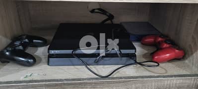 PS4 game console along with 2 remote controller available for sale. 0