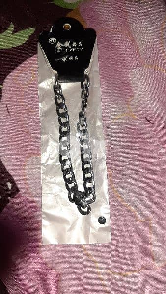 silver and black bracelets 0