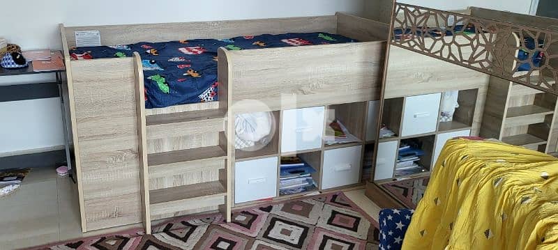 slightly used kid bunk bed with book storage 1