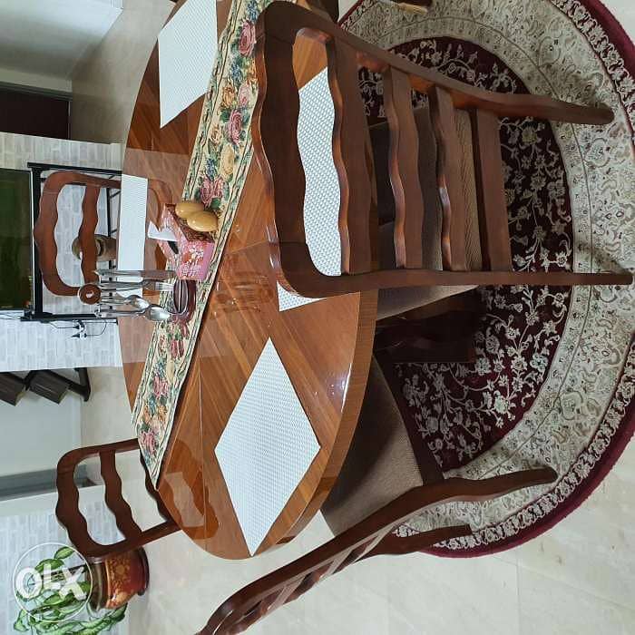 Round wooden dining table (without chairs) 1