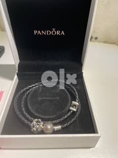 Unisex Pandora Silver Leather bracelet and charms worth 55 BD 0