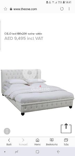 king size white leather bed.