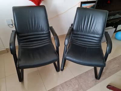 2 office chairs. Black leather finish. In very good condition