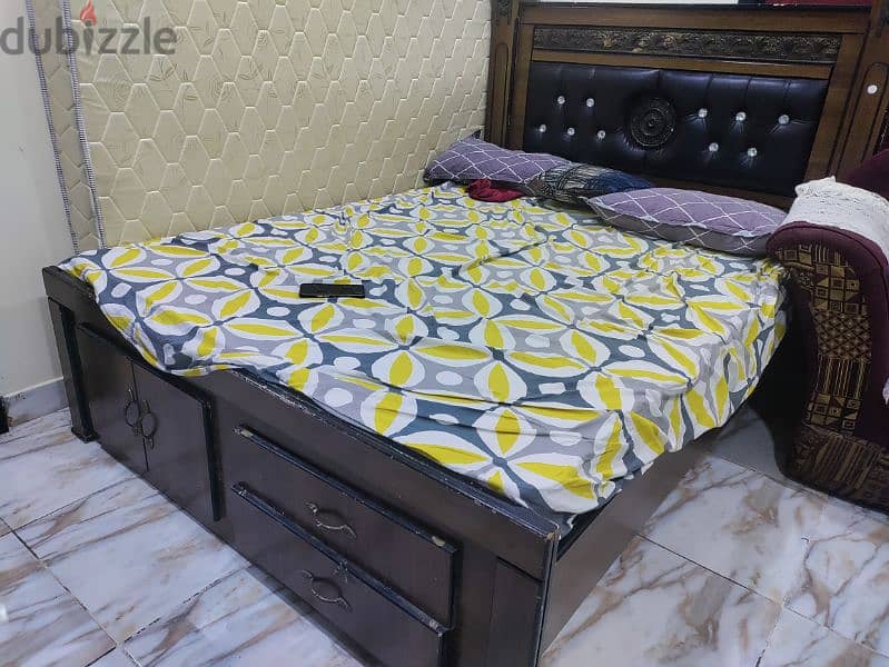 "queen size bed and mattress with storage space. . . 1