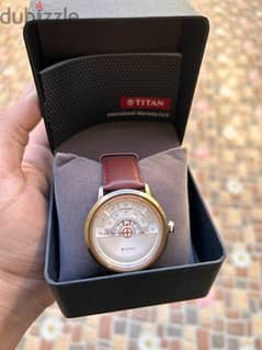 Titan watch with box and warranty original price 70BD