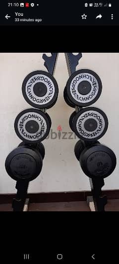 Technogym plates and dumbbells for sale 0