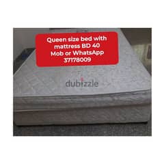 Queen size bed with mattress and other household items for sale