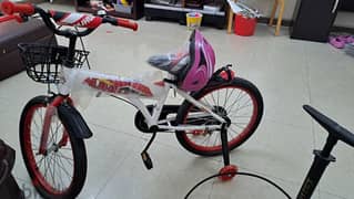 Red cycle + pink helmet + cycle pump