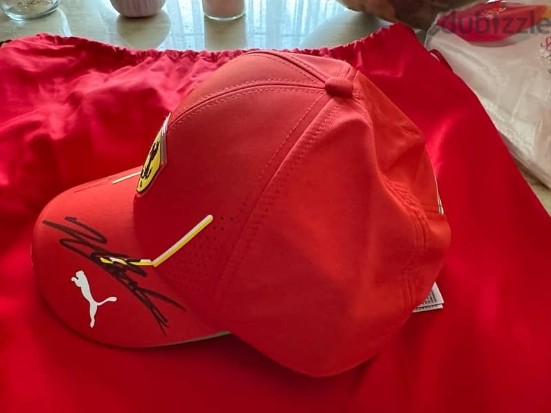 Original Ferrari cap signed by Charles Leclerc and Carlos Sainz 1