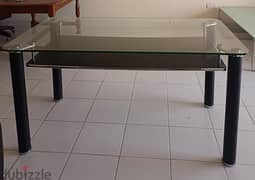 Good condition six seated  glass top dining table for sale