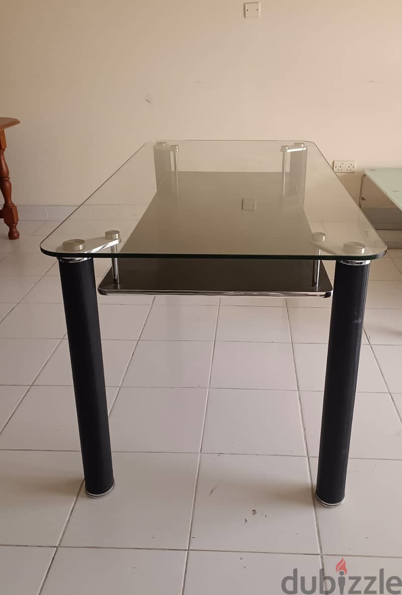 Good condition six seated  glass top dining table for sale 1