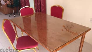 Tempered glass sheet in wooden dining table for sale.