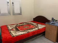 Double bed with wooden side table + 2 orginal cotton filled mattresses