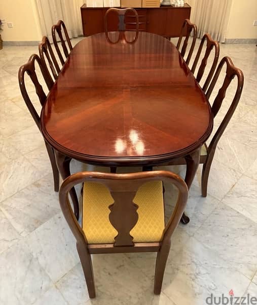 Pure wood dining table set in great condition comes with 8 chairs! 2