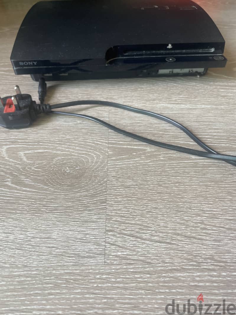 PlayStation 3 with power cable 1
