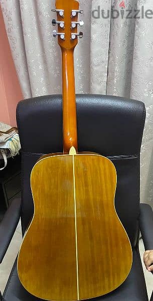 Acoustic Guitar with a Guitar bag, Capo and Picks. 3