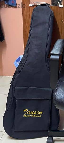 Acoustic Guitar with a Guitar bag, Capo and Picks. 4