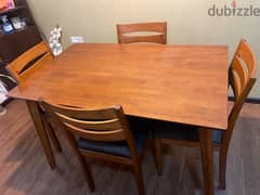 Woodn dining table with four chairs for sale!!
