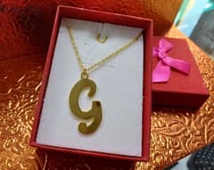 Gold G symbol necklace
