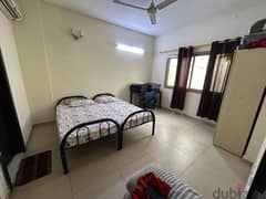 Spacious room for rent in a 2BHK apartment with bathroom & kitchen