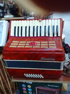 ANTIQUE MUSIC INSTRUMENT ORIGINAL UK MADE OLD. red baile accordion