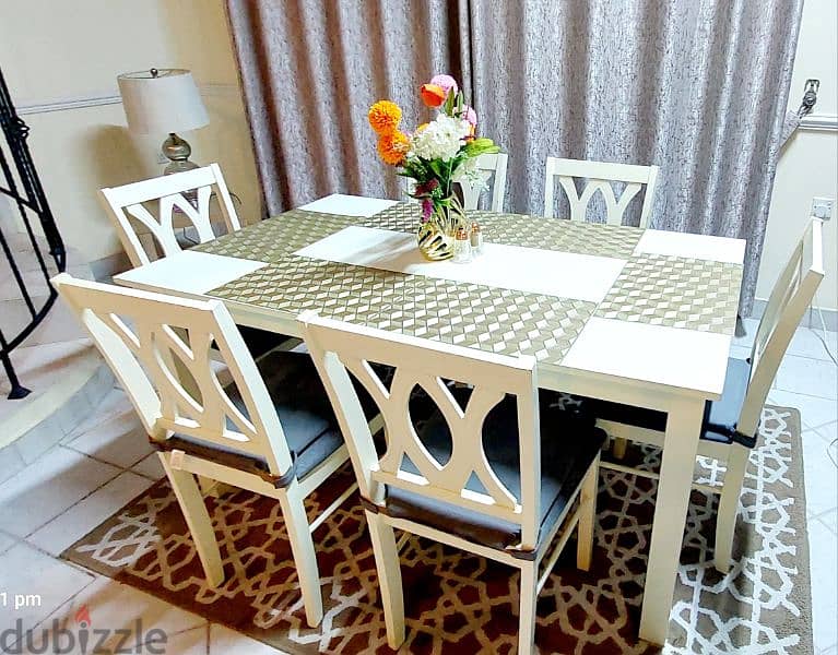 Home center dining table with 6 chairs.  Almost new. 1