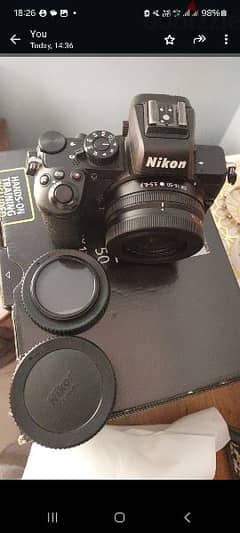 nikon z50 with the  kit lens 16_25mm two bettery and monopod 2 memory