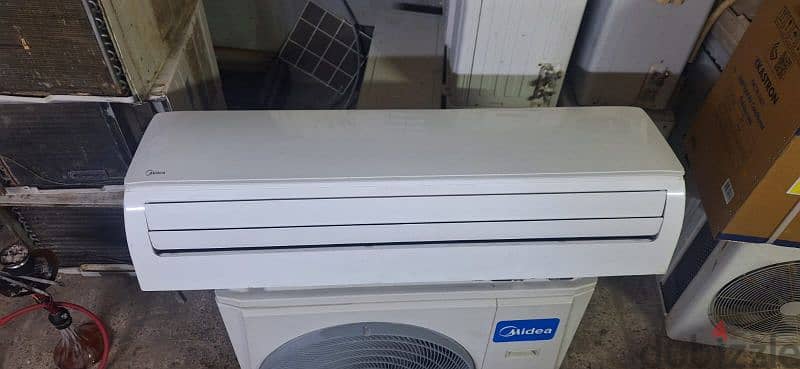 midea ac 2.5 ton spilt good condition good working with fixing with wa 2
