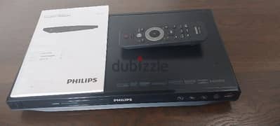 Philips DVD Player with remote control, cables, and manual. 0