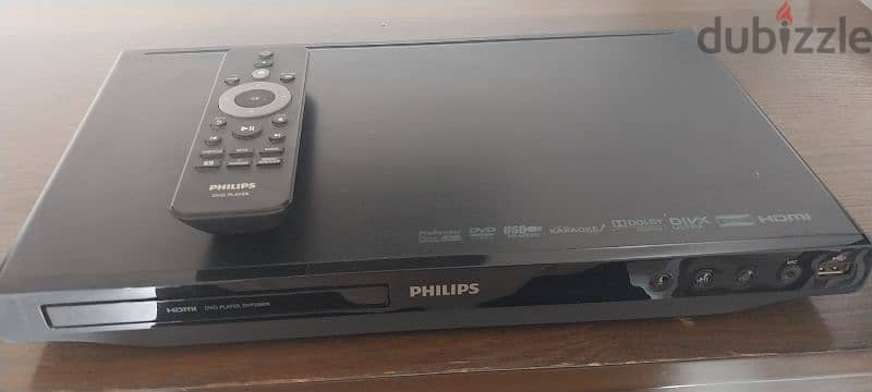 Philips DVD Player with remote control, cables, and manual. 2