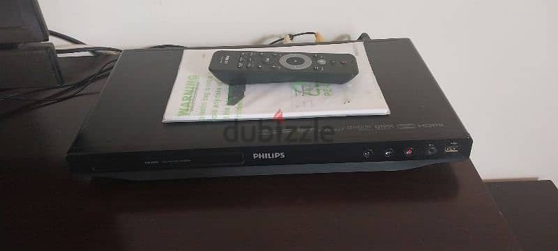 Philips DVD Player with remote control, cables, and manual. 3