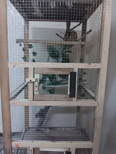 Brand new wooden bird cage with decorations inside for sale