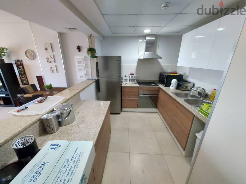 Best deal 2 BR cozy flat for sale in amwaj island . . !! 10