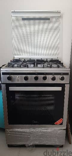 cooking rage with oven and storage rack in bottom