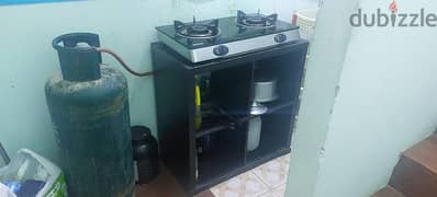 Gas cylinder with stove and regulater