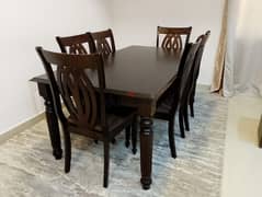 A dinig table with six chairs in a very good condition 50 BHD