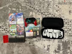 Used zelda oled nintendo switch with accessories and games