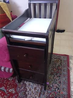 baby bed and cupboard