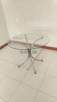 Sparingly used Glass round table