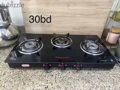 6 month used butterfly 3 burner glass top cooking stove