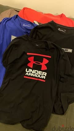 Under Armor t-shirts and polo