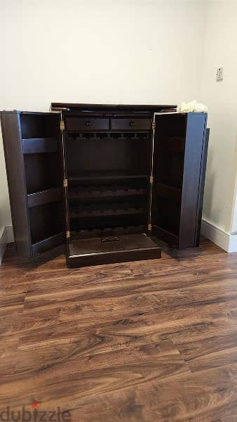 Home bar cabinet for storing bottles and glasses for sale. 0