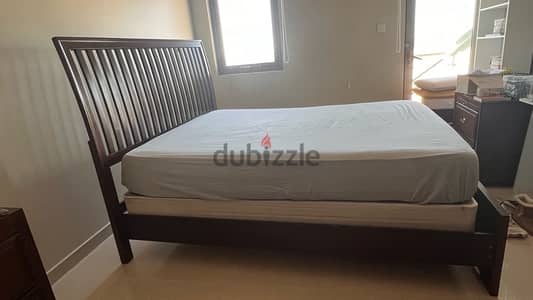 queen size bed and 2 side tables