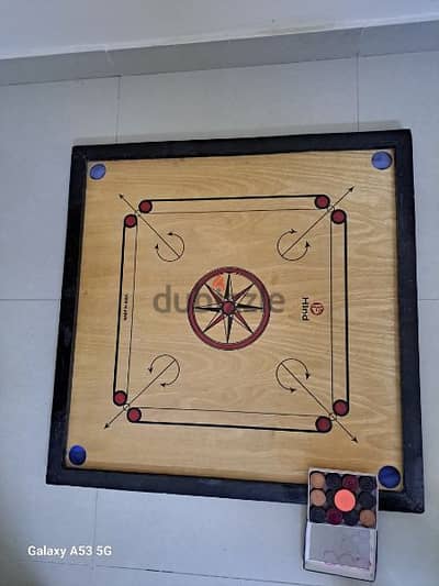 carrom board with coins