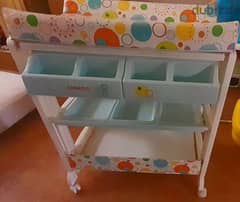 baby bath and changing table. 0