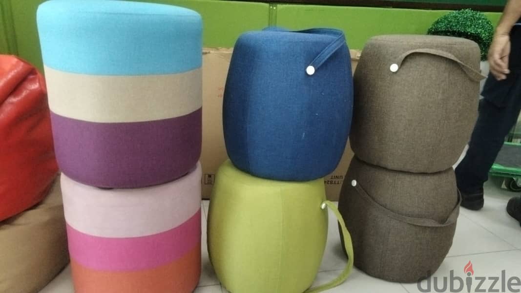 Carry on or Upholstered round fabric pouf 0