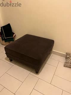 2 dark brown ottomans