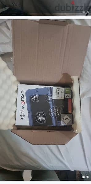 Open boxed New 3ds XL (Europe) with new sealed super smash game 1