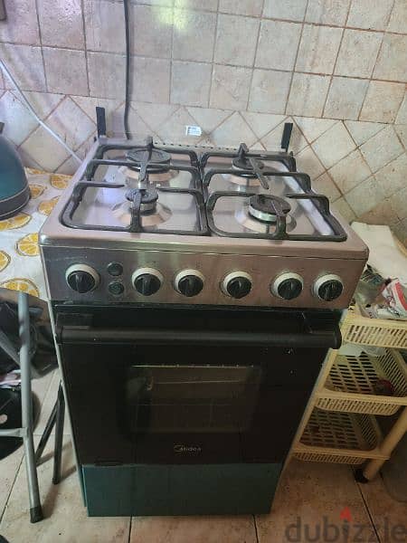 Midea 50x50 4 burner cooker with cylinder 0