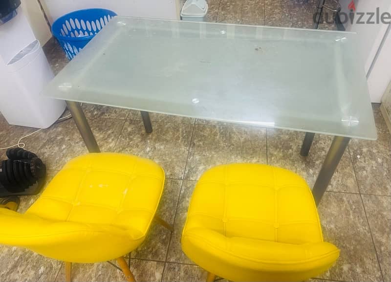 glass table with two chairs 1